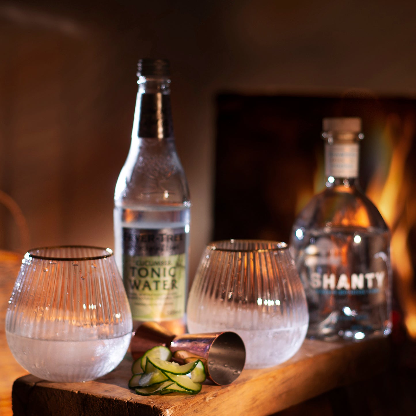 Shanty Spirit Seaweed Botanical Vodka Sea Cucumber Cocktail with open fire background
