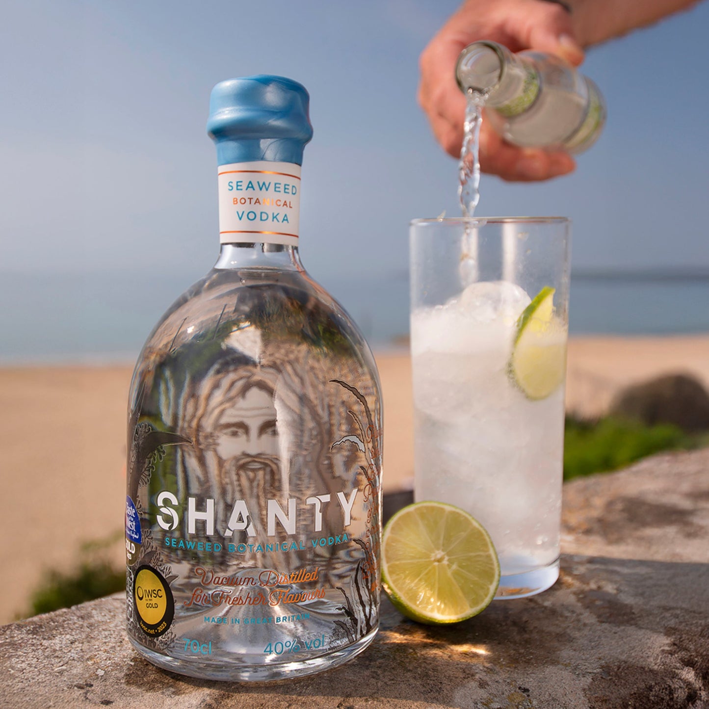 IWSC Gold Awarded Seaweed Botanical Vodka Bottle with Skinny Dip drink being poured.